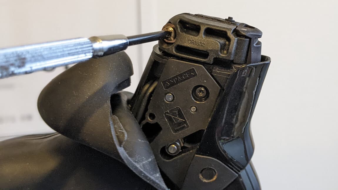 Loosen the battery port screw