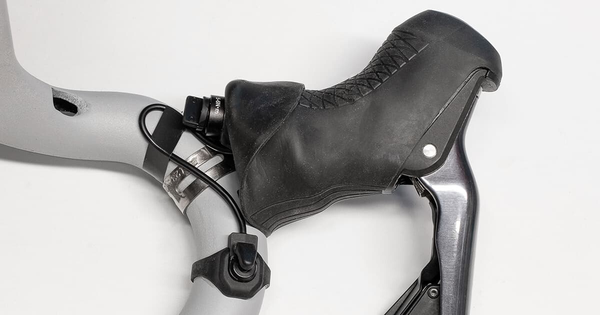 Shifter wire taped to handlebar