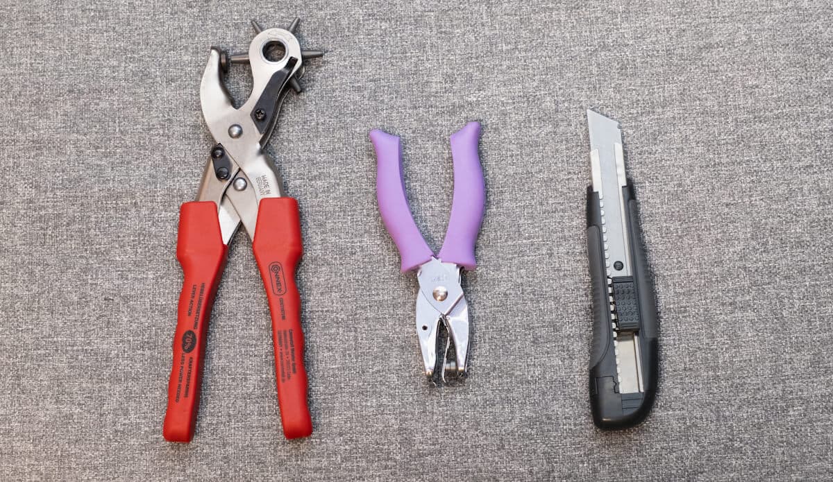 leather hole punch, regular (paper) hole punch, knife