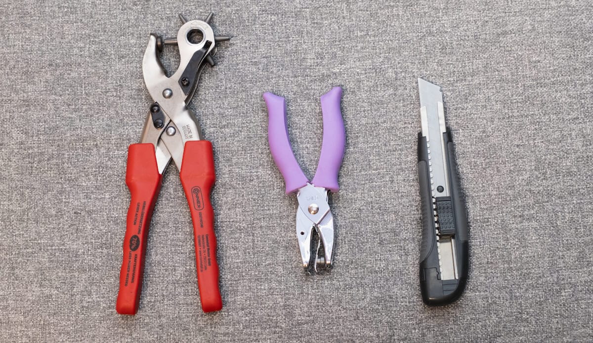 leather hole punch, regular (paper) hole punch, knife