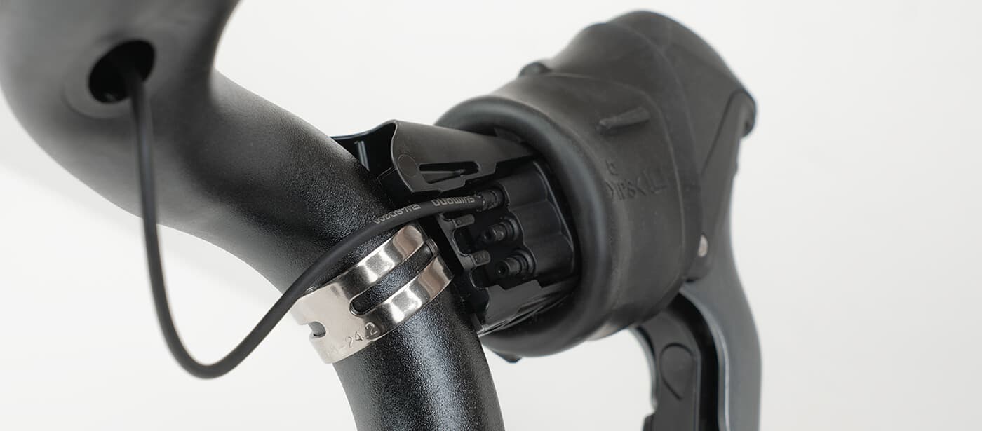 Leave a bit of slack in the wire, so it doesn't get pulled loose if the shifter moves