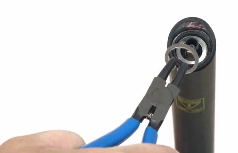 Install the snap ring using pliers